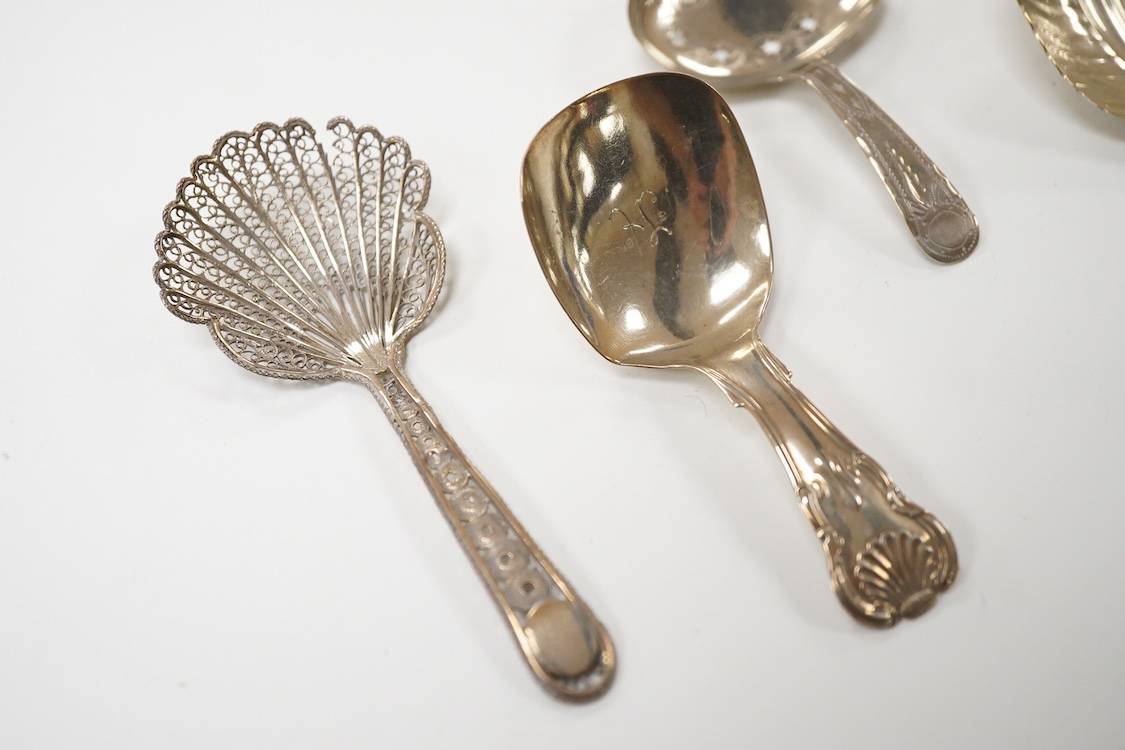 Three assorted silver caddy spoons, including star cut bowl by John Thropp, Birmingham, 1817, 69mm, hourglass? pattern, Joseph Wilmore, marks rubbed, bright cut engraved handle London, 1856 and a filigree white metal spo
